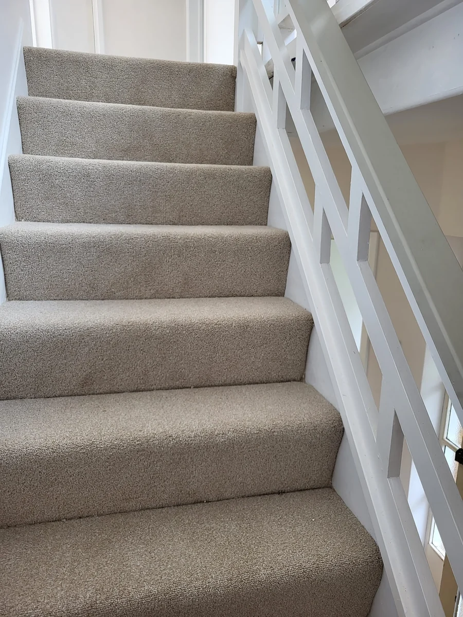 Decorated staircase with a fitted carpet runner in Coventry by Godiva Decorators (completed)