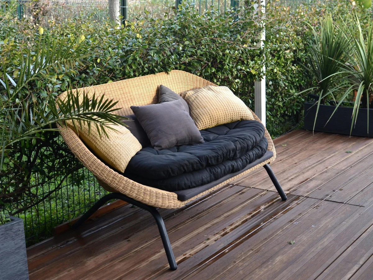 Garden deck with rattan furniture freshly treated
