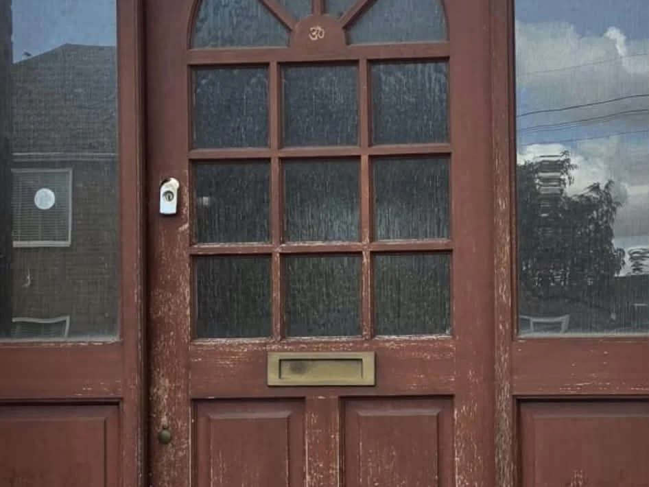 Flaking front door before restoration by Godiva Decorators, Coventry