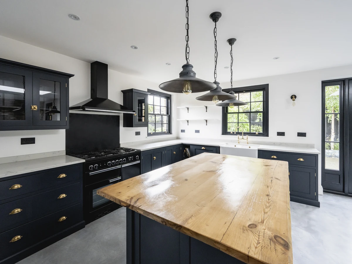 Spacious dark navy kitchen cabinets painted by Godiva Decorators
