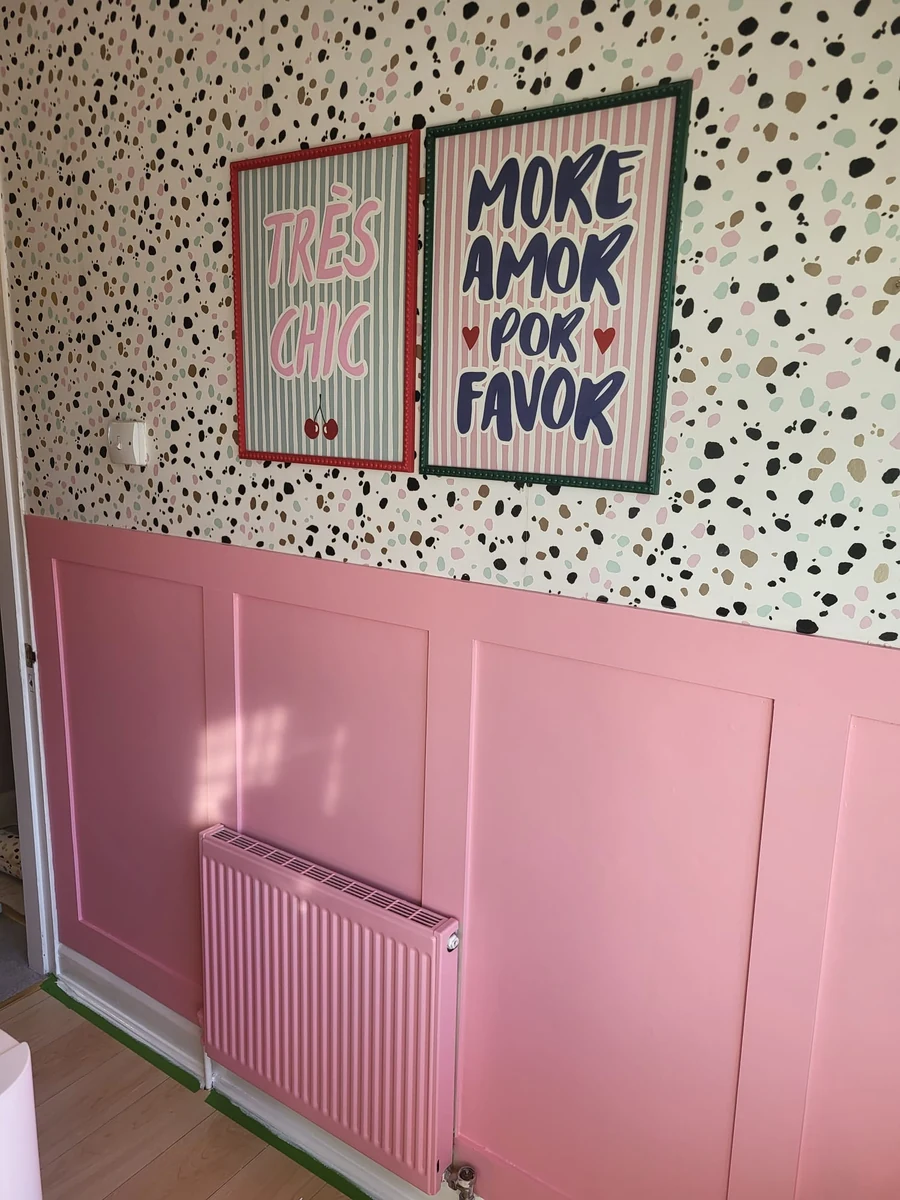 Freshly decorated room with a pink feature wall and styled radiator in Coventry by Godiva Decorators (completed)
