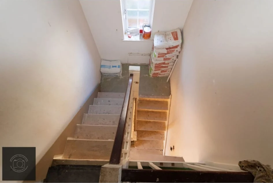 Repainted staircase and landing in an empty Coventry house