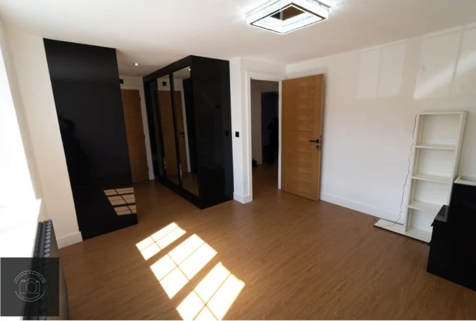 Decorated room with warm wood tones in Coventry by Godiva Decorators (completed)