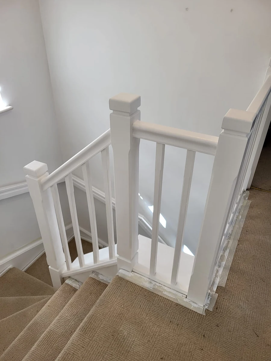 Bright white staircase and landing in a Coventry property